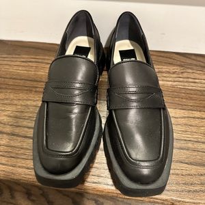 Square toed black leather loafers